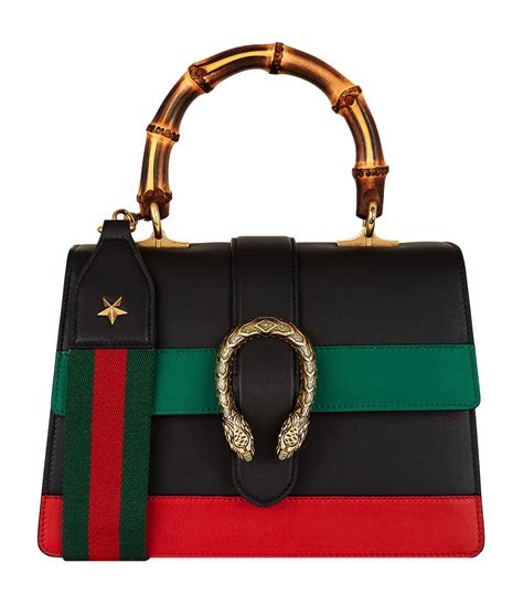 gucci with bamboo handle.